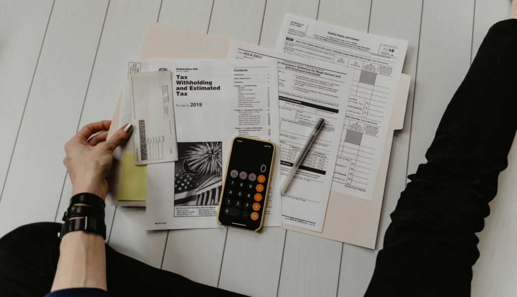 Finance professional reviewing figures with a calculator
